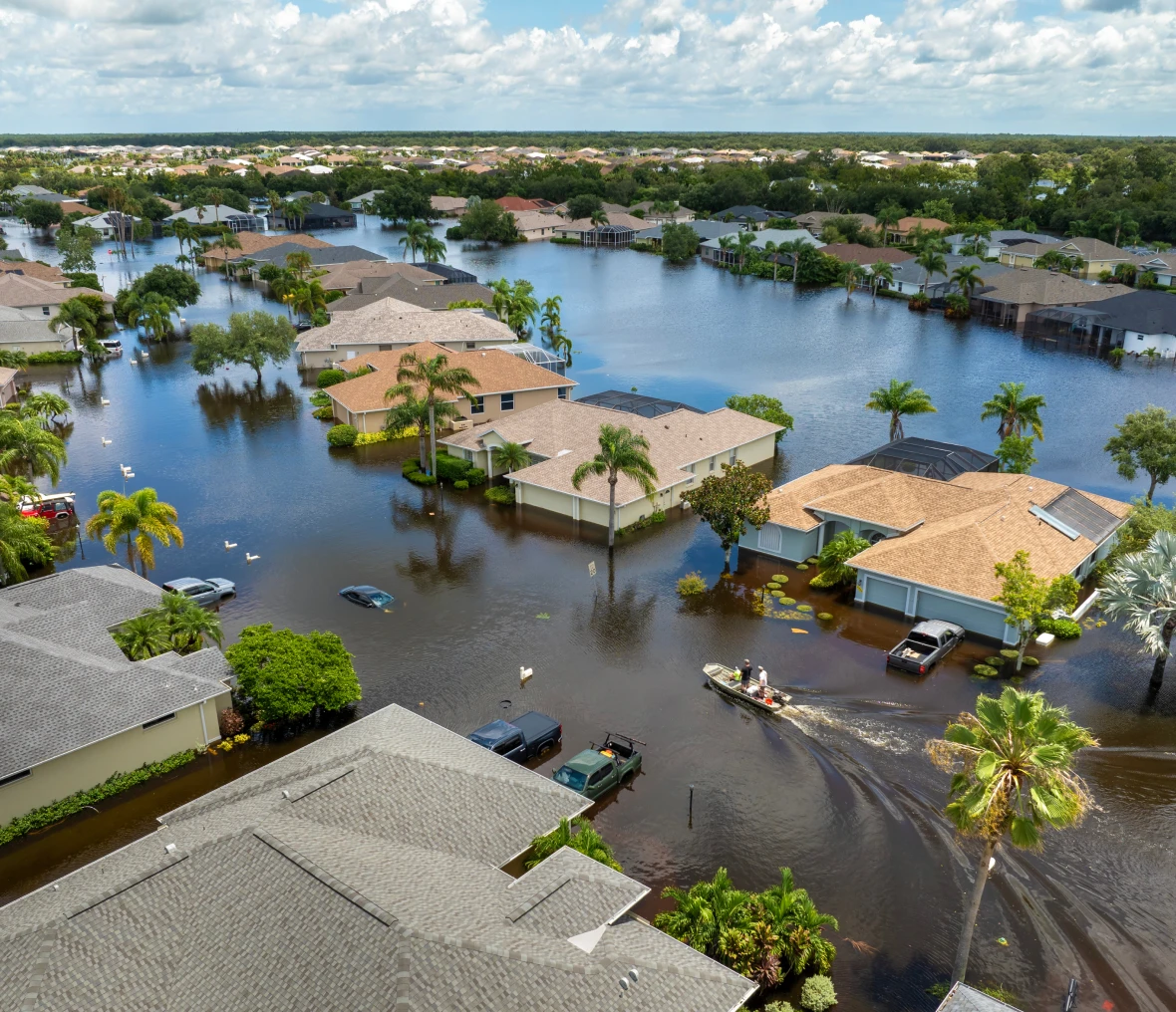 Flooded residential neighborhood with submerged streets.